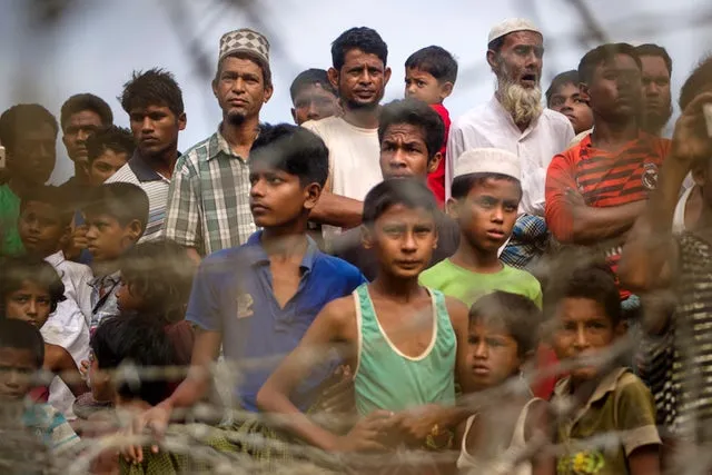 Rohingya refugees gather in the "no man's land" behind Myanmar's border with Bangladesh on April 25, 2018. YE AUNG THU/AFP/Getty Images